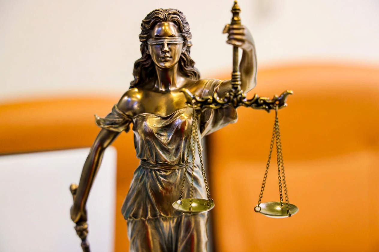 close up of lady justice statue with scales